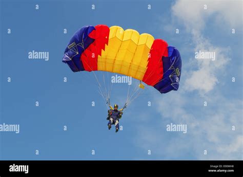 One Day With Parachutist In Airfield The Skydiver Lands Under The Blue
