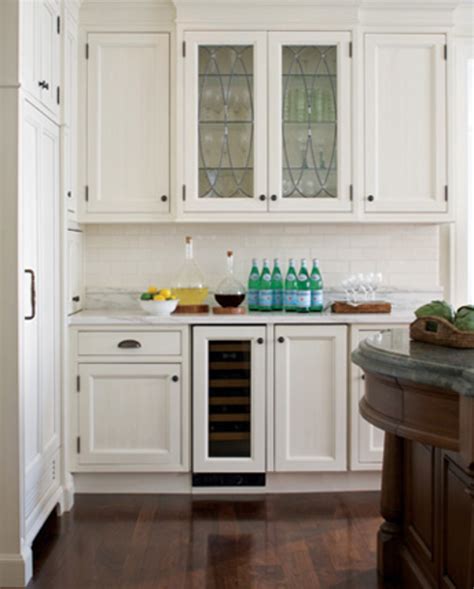 The householder painted the lower cabinets blue and the upper cabinets white, changed upper cabinet facing with glasses and shelves. Home Improvement Ideas - White Kitchen Cabinets with Glass Doors | HubPages