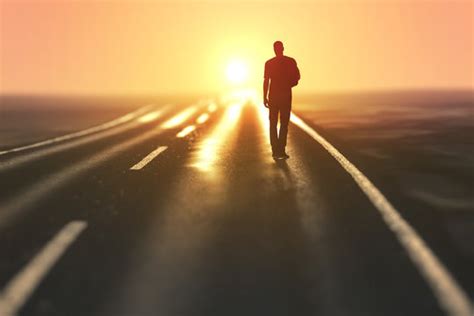 Man Walking Away On The Road