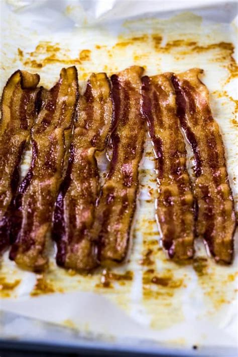 Arrange bacon strips on foil, overlapping as little as possible. How To Bake Bacon in the Oven - thestayathomechef.com