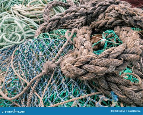 Old And Unraveled Fishing Ropes And Nets Grouped Together For Review