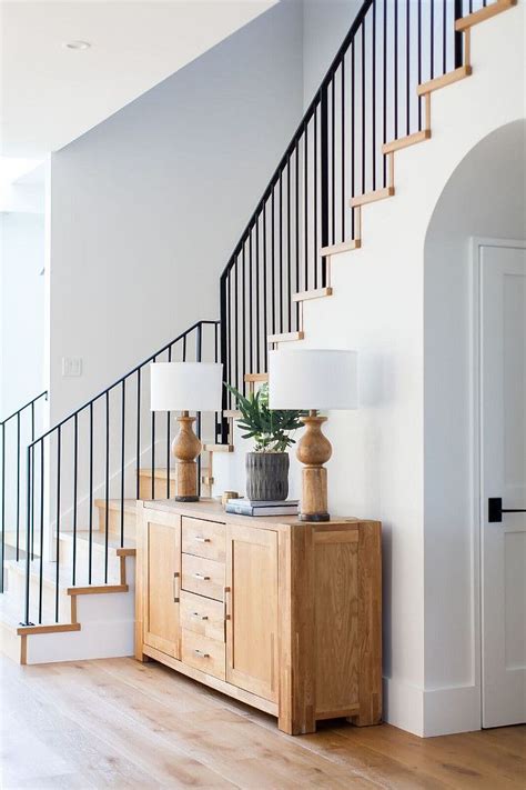 Top 100 modern staircase design ideas 2020 | unique living room stair designs for home interior. Modern farmhouse foyer features a custom staircase with wrought iron stair railing - Home Bunch ...