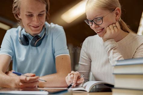 Two Smiling Talented Students Working Together On University Project