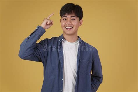 Portrait Of Handsome Young Asian Man Dressed Casually Isolated Smiling
