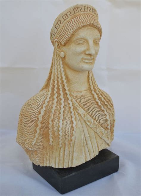 A Statue Of A Woman With Braids On Her Head