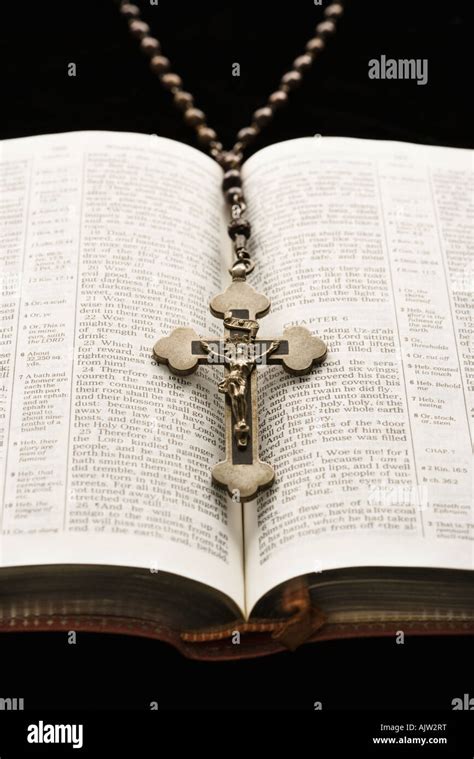 Rosary With Crucifix Lying On Open Bible Stock Photo Royalty Free