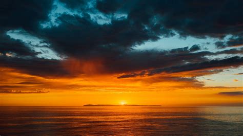 Sea Horizon Sunset Under Black Blue Cloudy Sky 4k Hd Nature Wallpapers