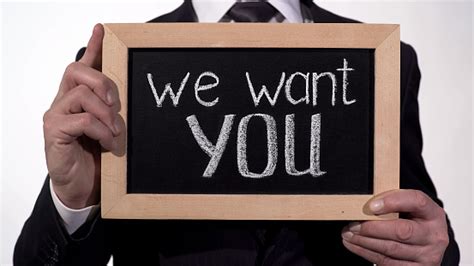 We Want You Phrase On Blackboard In Businessman Hands Promising Job