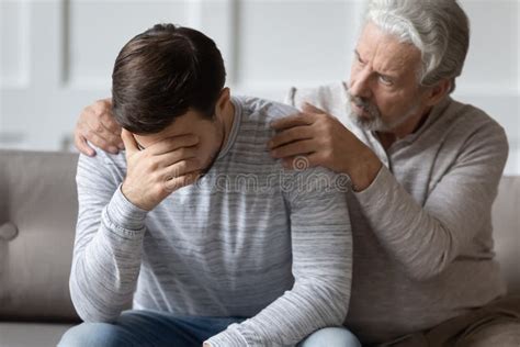 caring elderly father comfort upset adult son stock image image of care offended 176489721