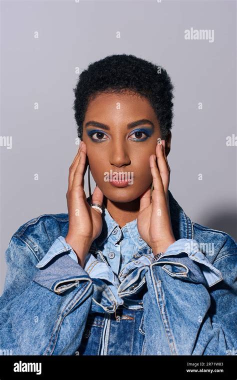 Young African American Model With Vivid Makeup And Short Hair Touching