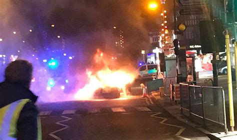 Footage from london where a powerful explosion thundered at the elephant and castle metro station. Car explodes into flames at Christmas fair in London. - RED WHITE AND BLUE