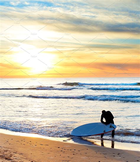 Surfer With Surfboard At Sunset ~ Sports Photos ~ Creative Market