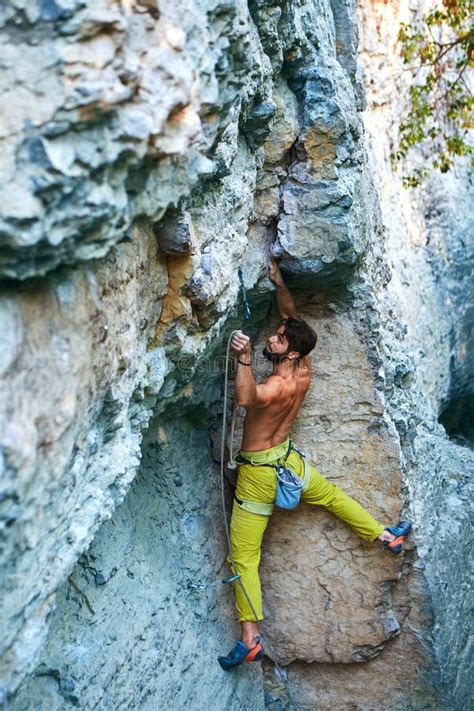 Rock Climbing Man Rock Climber Climbing The Challenging Route On The