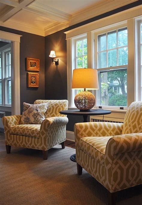 Two Chairs And Table In Front Of Large Windows For The Front Window