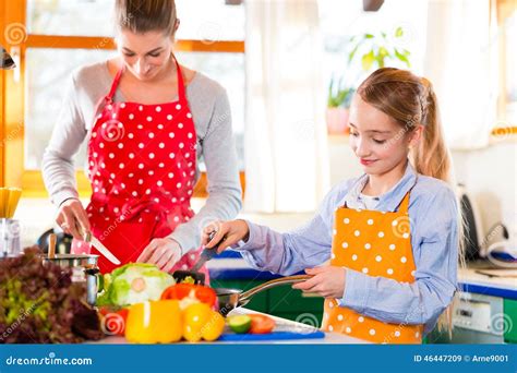 Mother Teaching Daughter Cooking At Home Stock Image Image Of Child