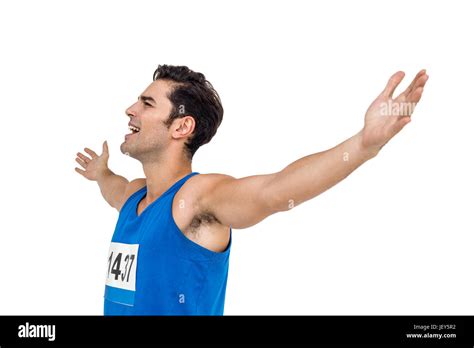 Excited Male Athlete With Arms Outstretched Stock Photo Alamy