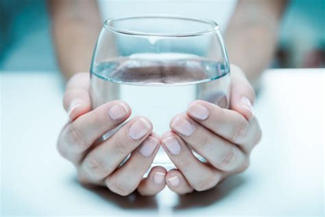 Female Hand Holding A Glass Of Clean Water Close Up · Free Stock Photos