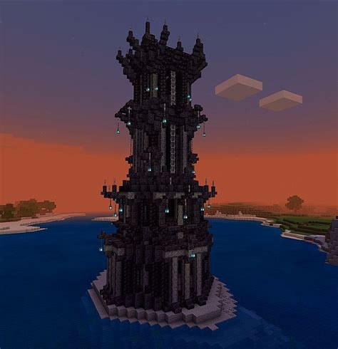 A Tall Tower Sitting On Top Of A Body Of Water In Front Of A Sunset