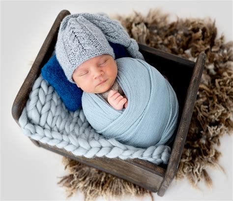 Premium Photo Adorable Newborn Baby Boy Swaddled In Fabric And