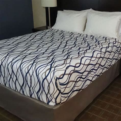 Choose from one of our decorative top sheets, coverlets or bedspreads to complete your hotel bedding ensemble. Wavy Stripe Decorative Top Sheets | National Hospitality