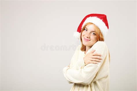 Gorgeous Redhead Female Wearing Santa`s Hat With Pop Pom Celebrating Winter Festive Season