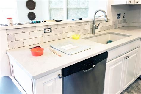 Welcome back to tile week, friends! DIY- How to Install a Marble Subway Tile Backsplash ...