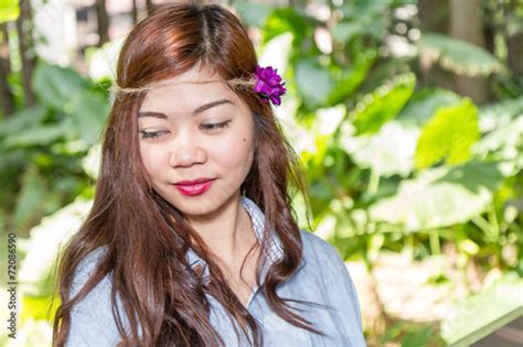 Filipina Woman In A Garden Looking Away From Camera Stock Photo Adobe
