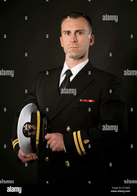 United States Navy Officer In Service Dress Blues Uniform With Stock