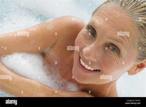 Mature Woman Enjoying Bubble Bath Tilt Stock Photo Alamy
