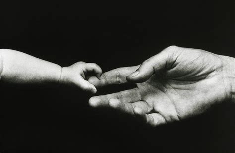 Babys Hand Touching An Adults Hand Photograph By Simon Fraserscience