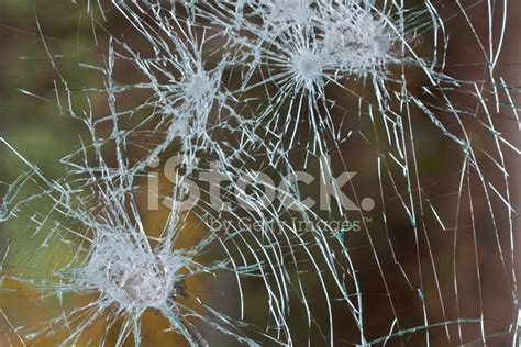 Bullet Holes In A Window Stock Photos