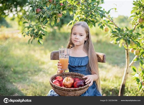 Cute Little Girl Holding Glass Apple Juice Basket Red Delicious Stock