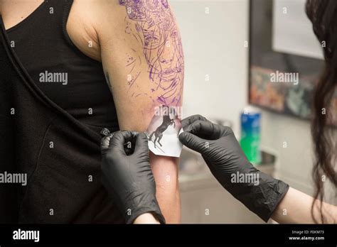 Tattoo Artist At Work Stock Photo Alamy