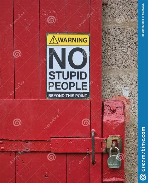A Humorous Safety Sign Saying Warning No Stupid People Beyond This