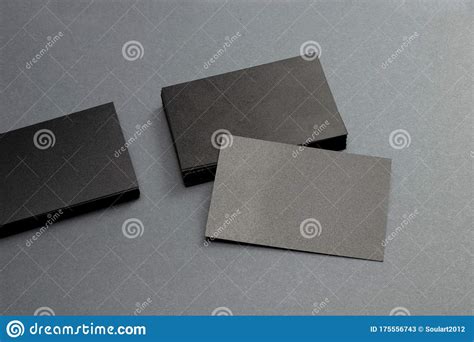 Black Blank Glossy Textured Stack Of Business Cards On Dark Paper