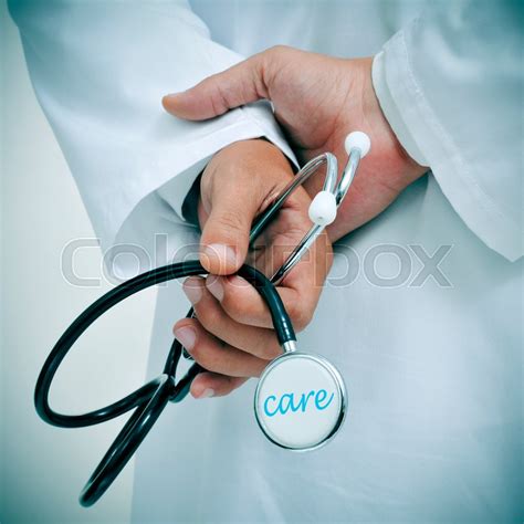 A Doctor Holding A Stethoscope With The Stock Image Colourbox