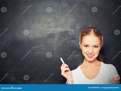 An Empty Blackboard With A Copy Space For Text And The Teacher Shows A