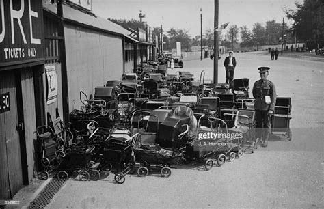 A Guard Watches Over The Multitude Of Prams Left Outside The Rushmoor