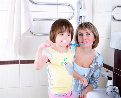 Mother And Daughter Brushing Their Teeth Stock Image Image Of