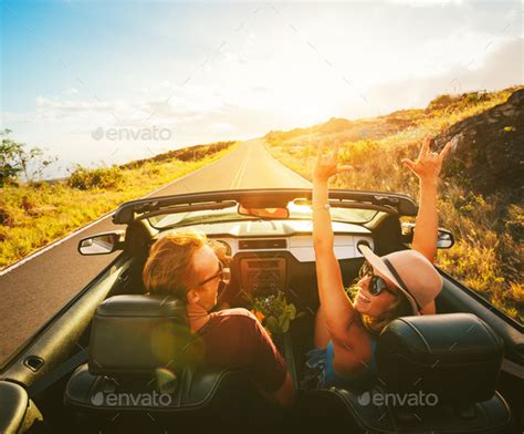 Happy Couple Driving In Convertible Stock Photo By Epicstockmedia