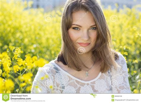 Pretty Girl In Field With Yellow Flowers Stock Image Image Of Dress