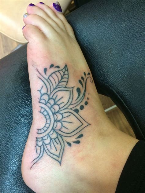 My First Tattoo Side Of Foot Half Mandala Flower Foot Tattoos For