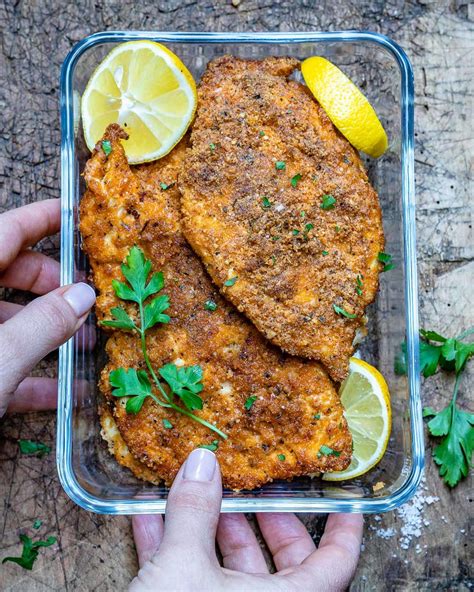 Set 3 wide, shallow bowls on a work surface. Baked Parmesan Chicken Cutlets (Keto Recipe) | RecipeLion.com