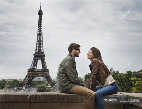 Couple In Paris With The Eiffel Tower In The Background — Mid Adult