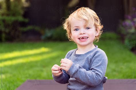 Portrait Of A Babe In A Yard In The Evening By Stocksy Contributor Angela Lumsden Stocksy