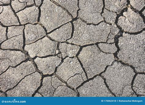 Close Up Dry Cracked Earth Texture For Background Top View Stock Photo