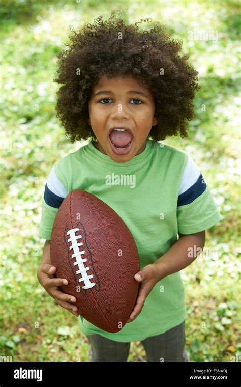 Young Boy Playing American Football Hi Res Stock Photography And Images