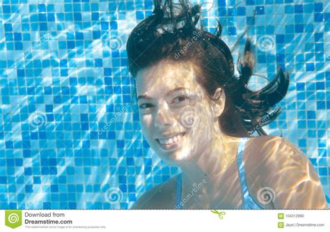 Girl Swims In Pool Underwater Happy Active Teenager Dives And Has Fun
