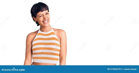 Young Brunette Woman With Short Hair Wearing Casual Clothes Winking