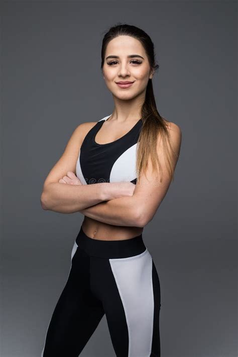 Portrait Of A Beautiful Fitness Woman With Crossed Arms Stock Photo